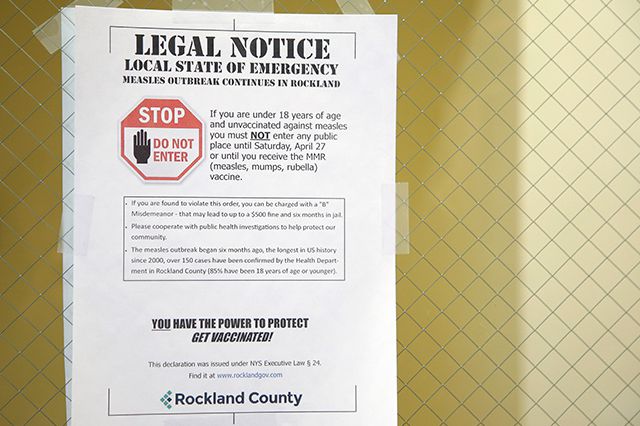 A sign from March 27, 2019 explaining the local state of emergency is displayed at the Rockland County Health Department in Pomona, N.Y.